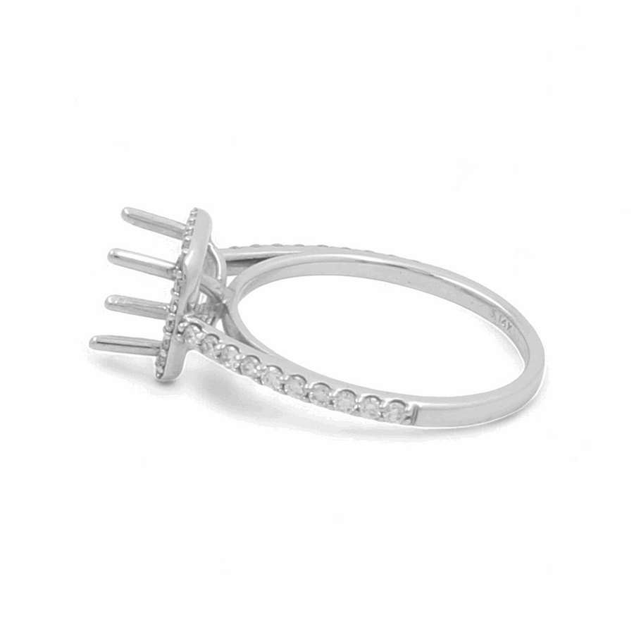 The Miral Jewelry 14K White Gold Bridal Woman's Ring with Diamonds boasts a prong setting designed to hold a gemstone, adorned with smaller diamonds embedded along the band—perfect for completing your wedding day ensemble.