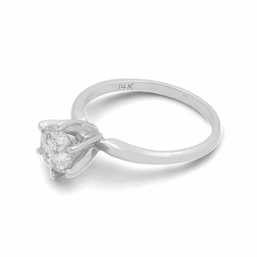 An elegant 14K white gold bridal ring from Miral Jewelry, featuring a round-cut solitaire diamond in a prong setting.