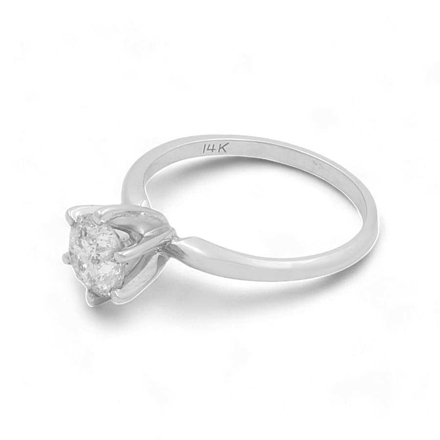 An elegant 14K white gold bridal ring from Miral Jewelry, featuring a round-cut solitaire diamond in a prong setting.