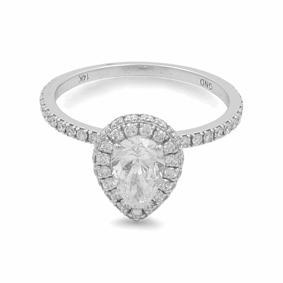 The Miral Jewelry 14K White Gold Bridal Woman's Ring with Diamonds features a stunning pear-shaped diamond surrounded by smaller diamonds on the band, making it the perfect addition to complete your wedding day ensemble.