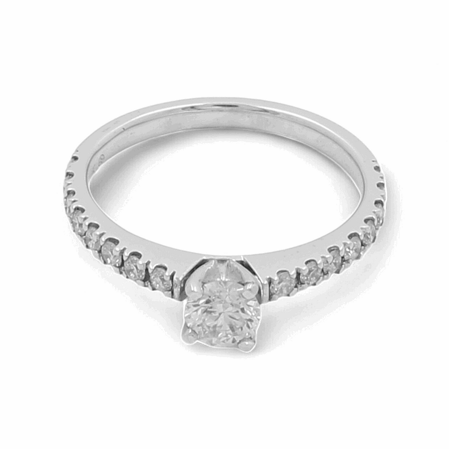 Introducing the Miral Jewelry 14K White Gold Bridal Woman's Ring with Diamonds, a breathtaking piece featuring a central round diamond beautifully complemented by smaller diamonds encrusted along the band.