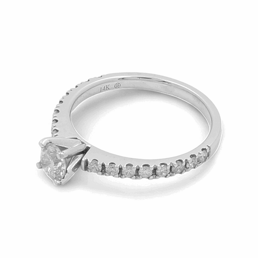 The Miral Jewelry 14K White Gold Bridal Woman's Ring with Diamonds is a stunning piece, showcasing a round diamond solitaire centerpiece and adorned with smaller diamonds along the band, making it an ideal timeless bridal ring.