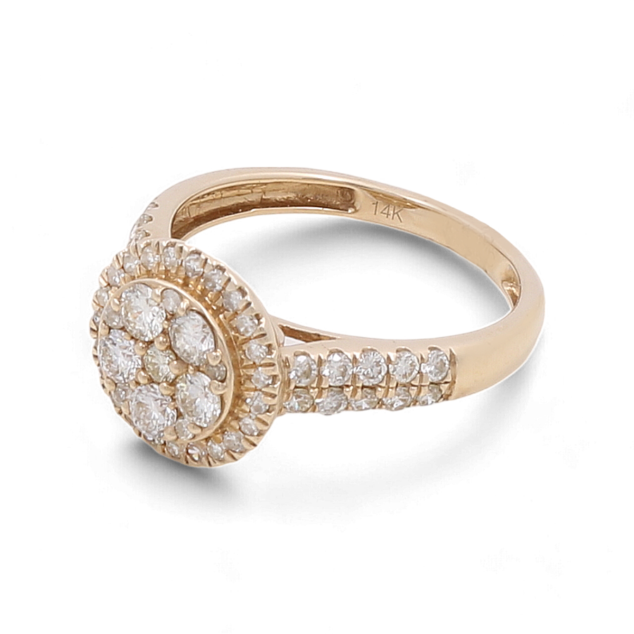 Miral Jewelry presents the 14K Yellow Gold Bridal Woman Ring with Diamonds, featuring a cluster of round diamonds at the center and additional diamonds adorning the band. The inner side of this handcrafted ring is marked "14K".