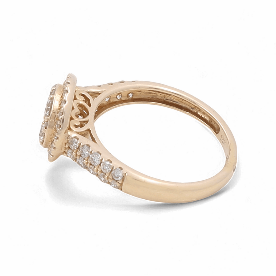 The Miral Jewelry 14K Yellow Gold Bridal Woman Ring with Diamonds showcases a round, diamond-encrusted setting and a band adorned with smaller diamonds.