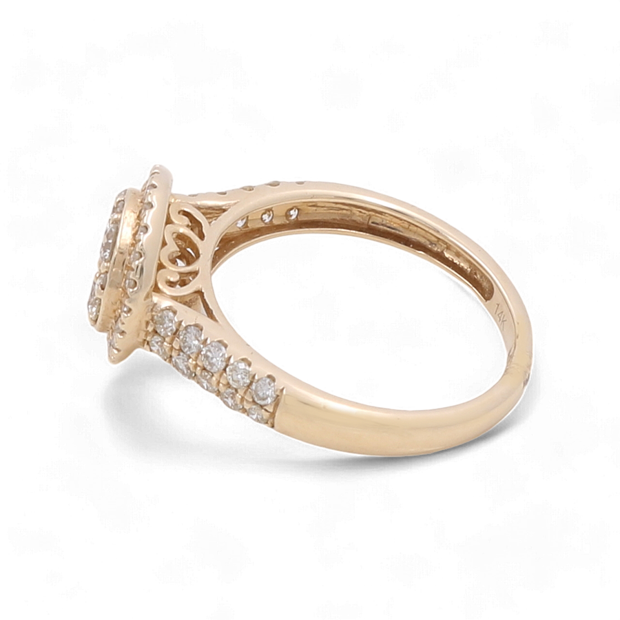 The Miral Jewelry 14K Yellow Gold Bridal Woman Ring with Diamonds showcases a round, diamond-encrusted setting and a band adorned with smaller diamonds.