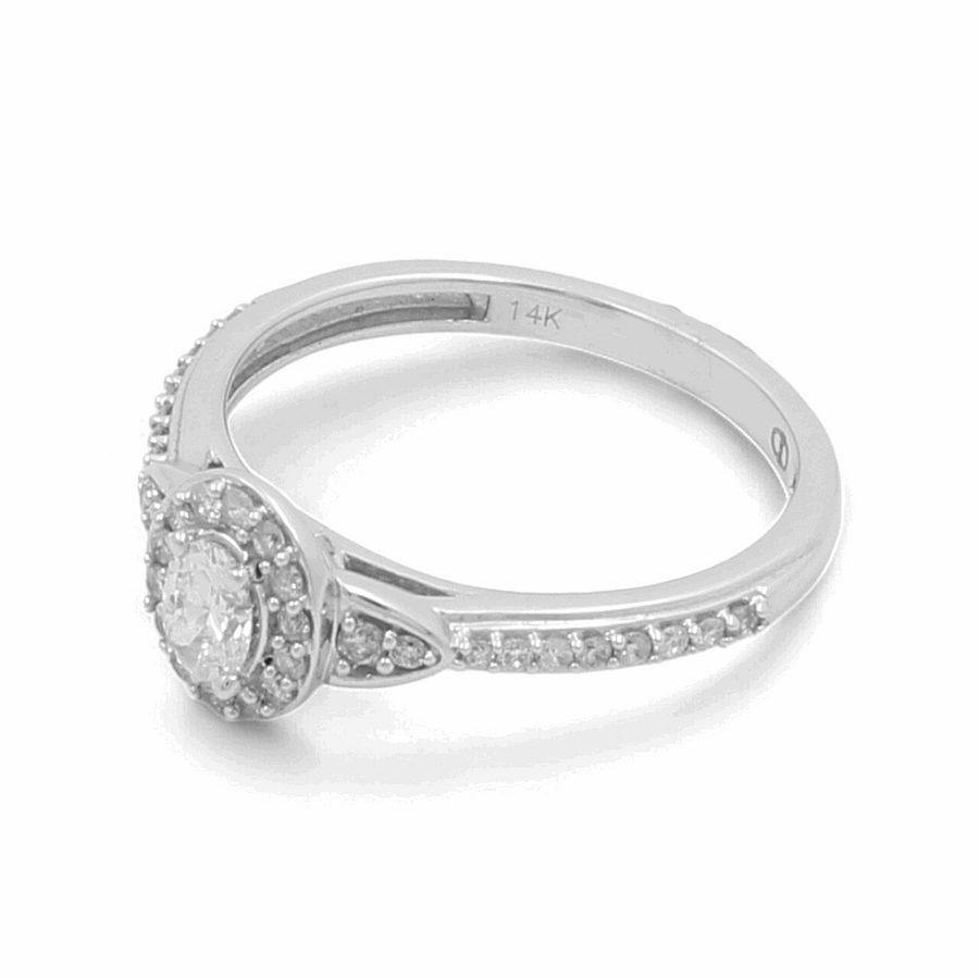 The Miral Jewelry 14K White Gold Bridal Woman Ring with Diamonds showcases a stunning silver band, adorned with a round-cut central gemstone encircled by smaller diamonds and featuring an elegant open shank design, making it the perfect engagement ring.