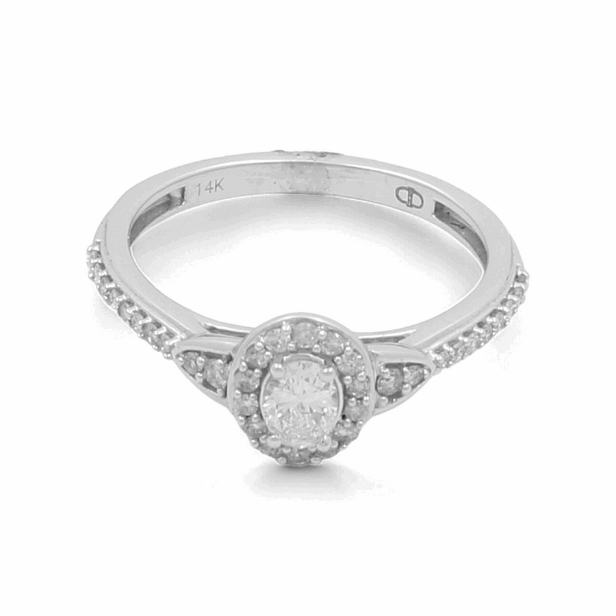 Presenting the Miral Jewelry 14K White Gold Bridal Woman Ring with Diamonds, a breathtaking piece featuring a central gemstone surrounded by shimmering diamonds along the band. The inside of this elegant ring is beautifully engraved with "14K.