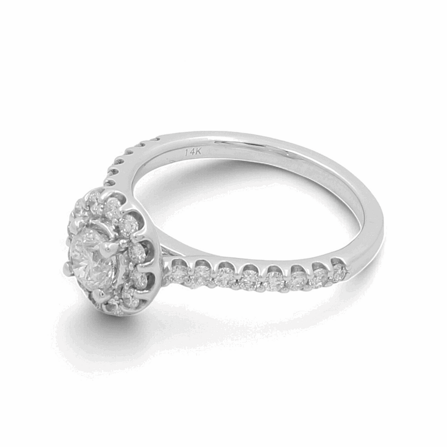 The Miral Jewelry 14K White Gold Bridal Woman Ring with Diamonds showcases luxury and elegance with its stunning round cut diamond center stone, surrounded by a halo of smaller diamonds, and additional diamonds set along the band.