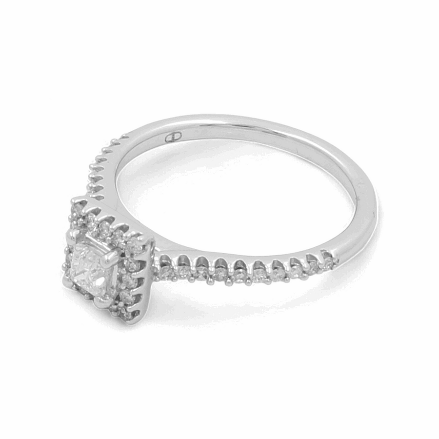 Introducing the stunning 14K White Gold Bridal Woman Ring with Diamonds by Miral Jewelry, featuring a central rectangular-cut stone encircled by smaller circular diamonds along the band.