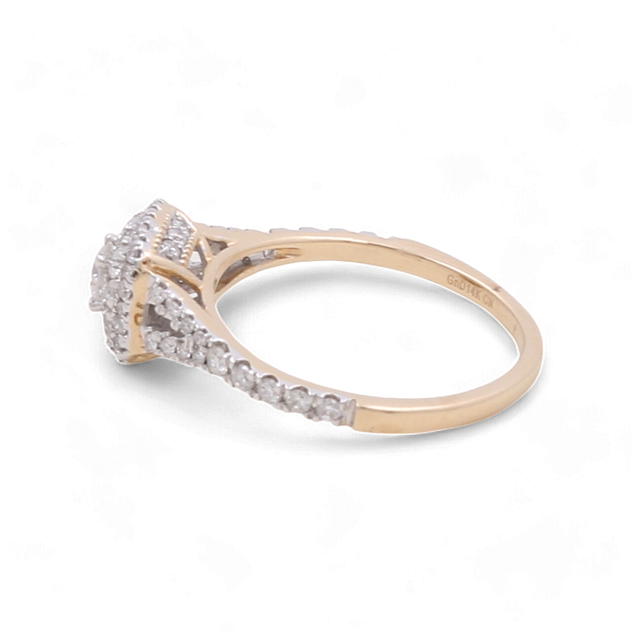 The Miral Jewelry 14K Yellow Gold Bridal Woman Ring with Diamonds showcases a cluster of diamonds arranged in a square pattern, complemented by additional diamonds encrusted along the band for an extra touch of luxury.