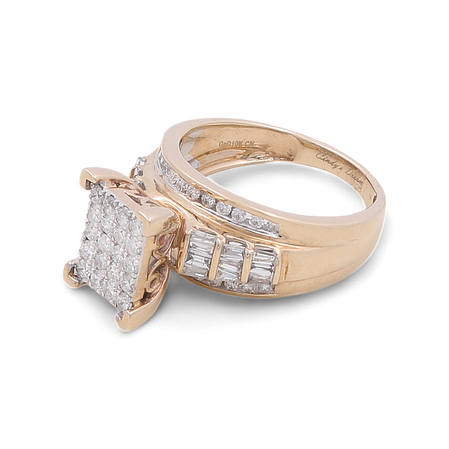 The 10K Yellow Gold Bridal Woman Ring with Diamonds from Miral Jewelry showcases a square cluster of small diamonds on top, complemented by additional small diamonds set into the band, embodying pure luxury.