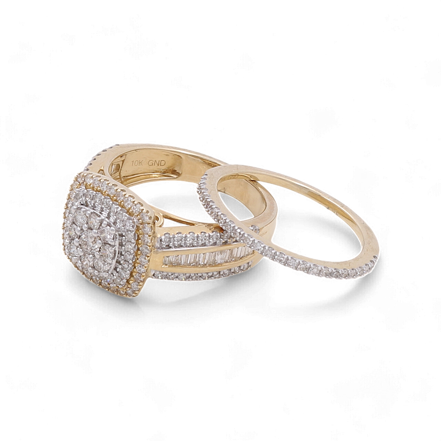 Two bridal rings from Miral Jewelry are pictured: one, the 10K Yellow Gold Bridal Woman Ring with Diamonds, features a prominent diamond cluster on top surrounded by smaller diamonds; the other showcases small diamonds lined around a slim band. Both rings are crafted from exquisite 10K yellow gold.
