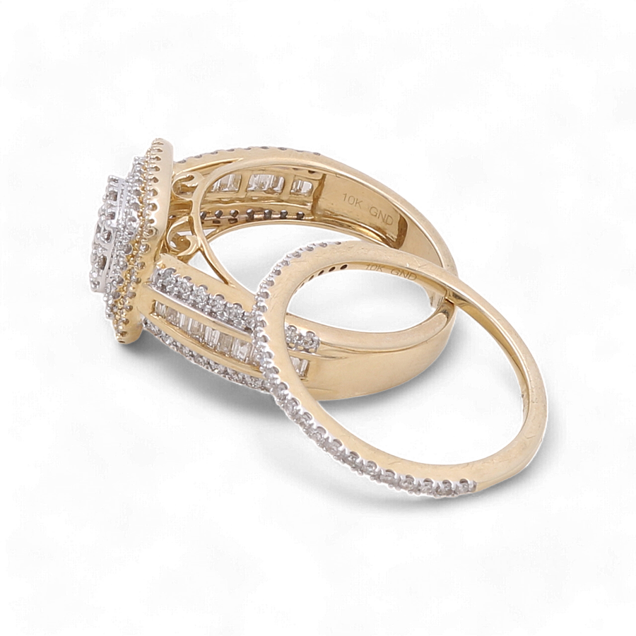 Two gold rings from Miral Jewelry, one being the 10K Yellow Gold Bridal Woman Ring with Diamonds featuring a large, detailed setting with smaller embedded stones, and the other a simpler thin band adorned with small luxury diamonds, displayed against a white background.