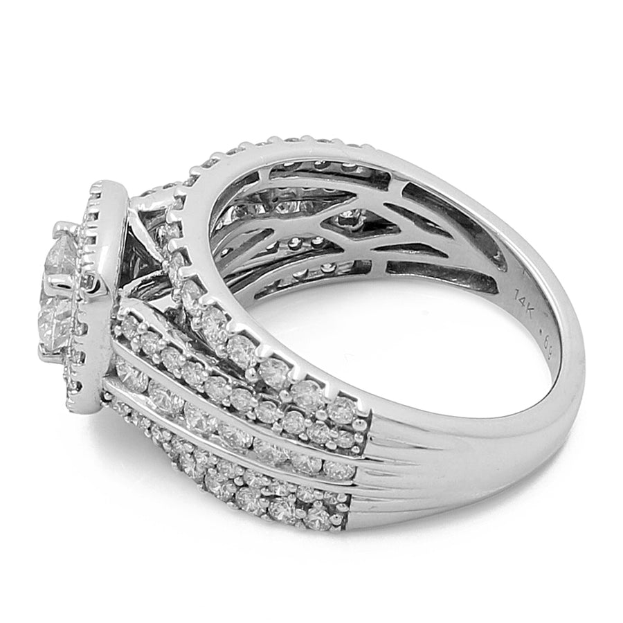 A Miral Jewelry 14K White Gold Women's Contemporary Wedding Ring 0.62Tw Round Diamonds-1.38Tw Round Diamonds with a central diamond and numerous round diamonds encrusted along the band. The intricate contemporary design features an elevated setting and detailed latticework underneath.