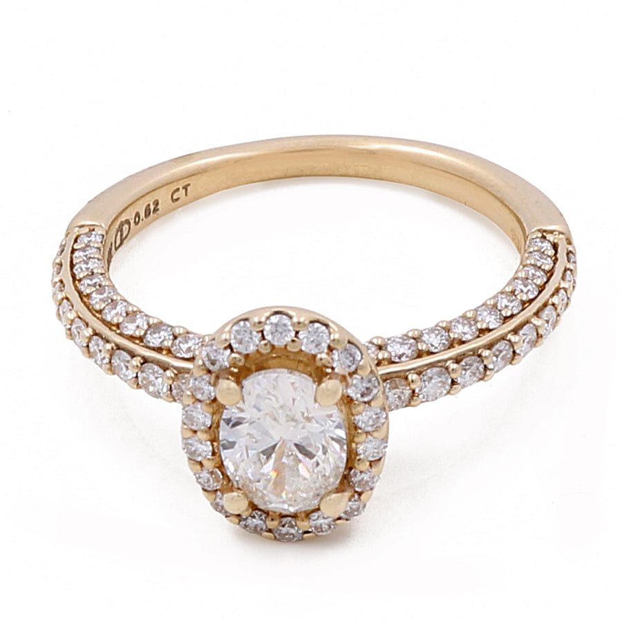 Miral Jewelry's 14K Yellow Gold Women's Contemporary Engagement Ring 0.62Tw Oval Diamonds-0.54Tw Round Diamonds features a 14K yellow gold band adorned with round diamonds and an oval-cut center diamond surrounded by a halo of smaller diamonds.