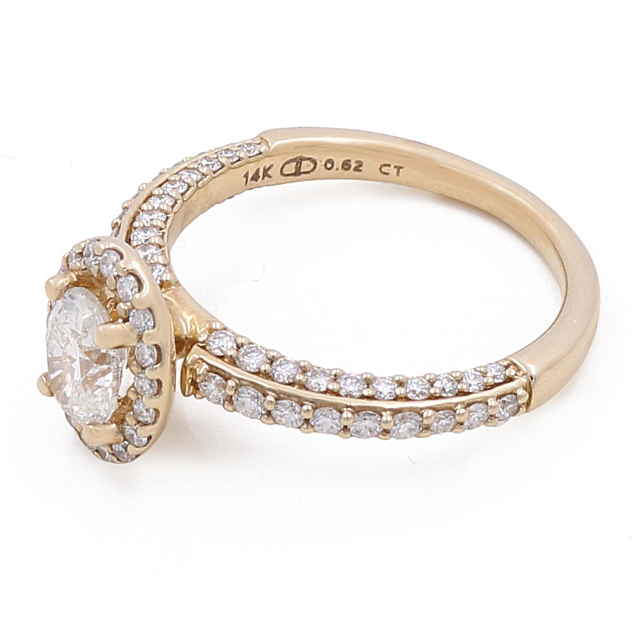 A **Miral Jewelry 14K Yellow Gold Women's Contemporary Engagement Ring 0.62Tw Oval Diamonds-0.54Tw Round Diamonds**, crafted in 14K yellow gold, featuring a central oval diamond encircled by a halo of smaller round diamonds, with additional diamonds set along the band. Marked "14K 0.62 CT" inside.