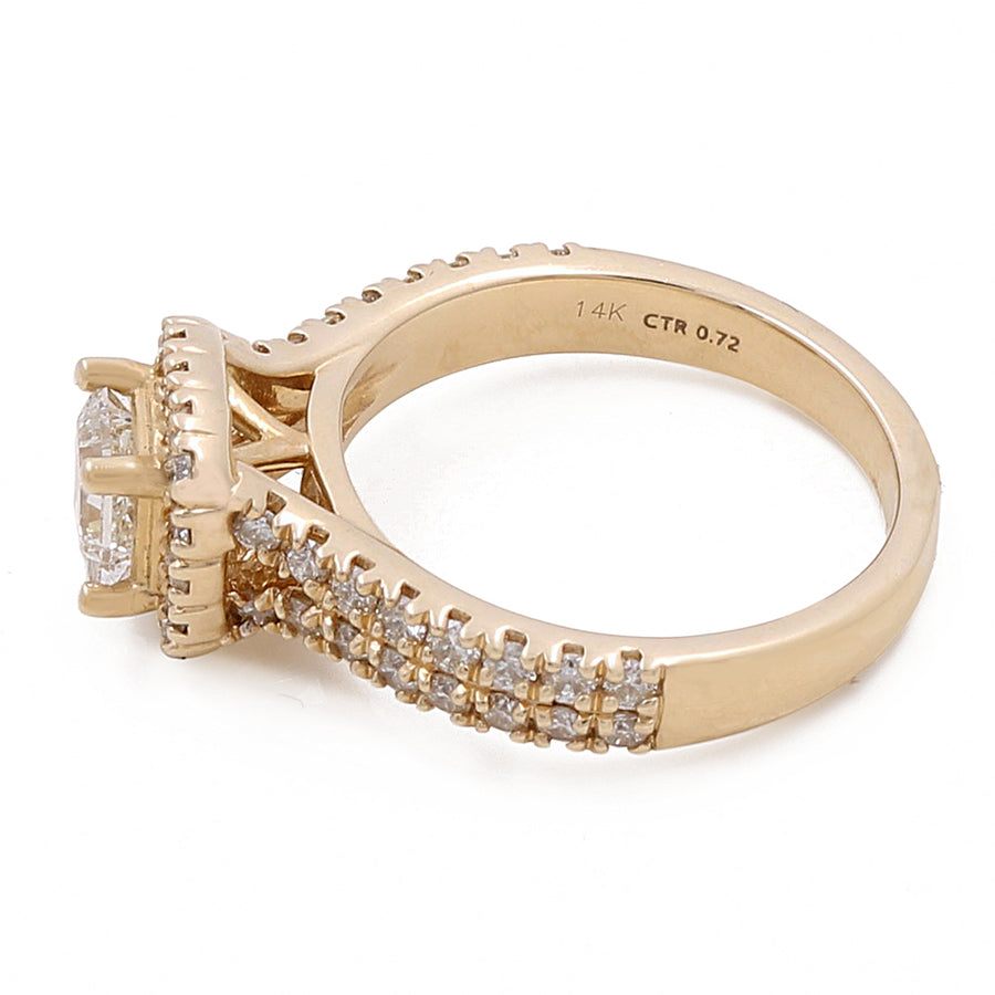 A Miral Jewelry 14K Yellow Gold Women's Contemporary Engagement Ring with 0.75Tw Round Diamonds featuring a central diamond in a prong setting, surrounded by round diamonds encrusted along the band.
