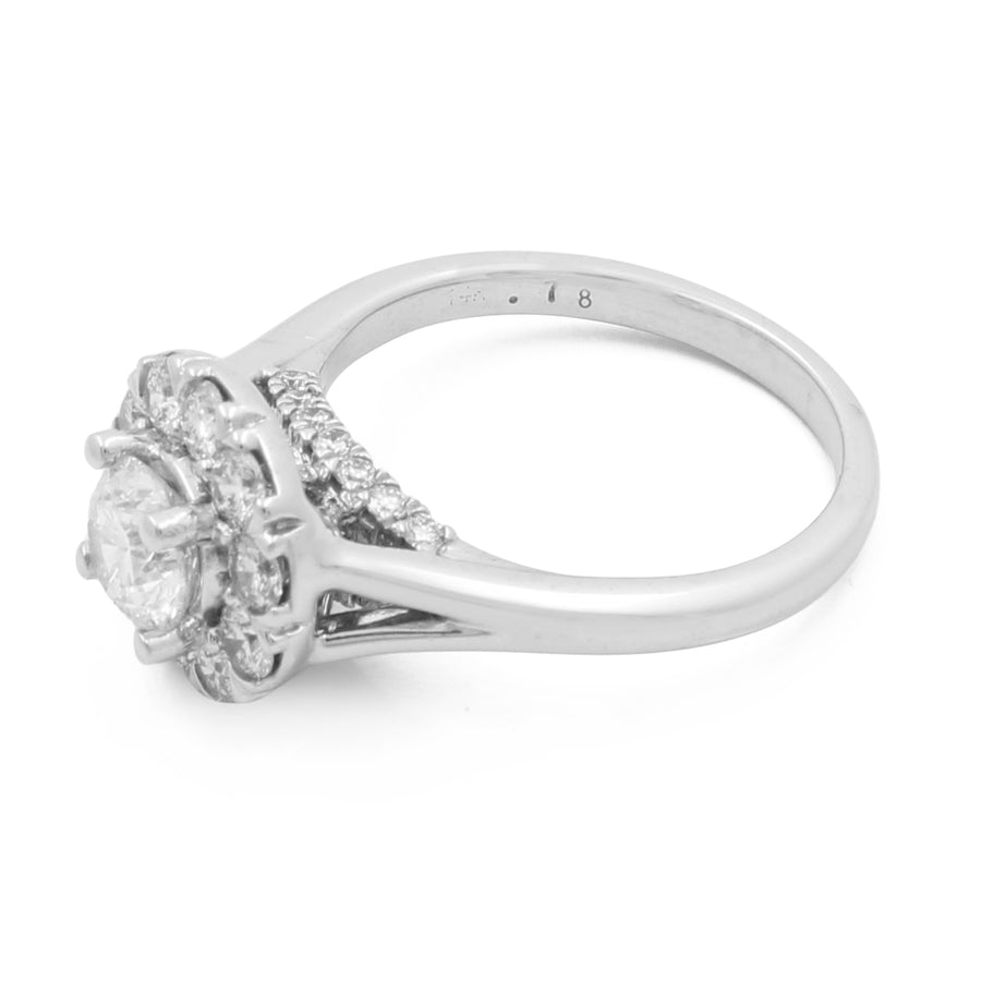 A Miral Jewelry 14K White Gold Women's Contemporary Engagement Ring with 0.75Tw Round Diamonds, featuring a large central diamond surrounded by smaller round diamonds on the band and setting.