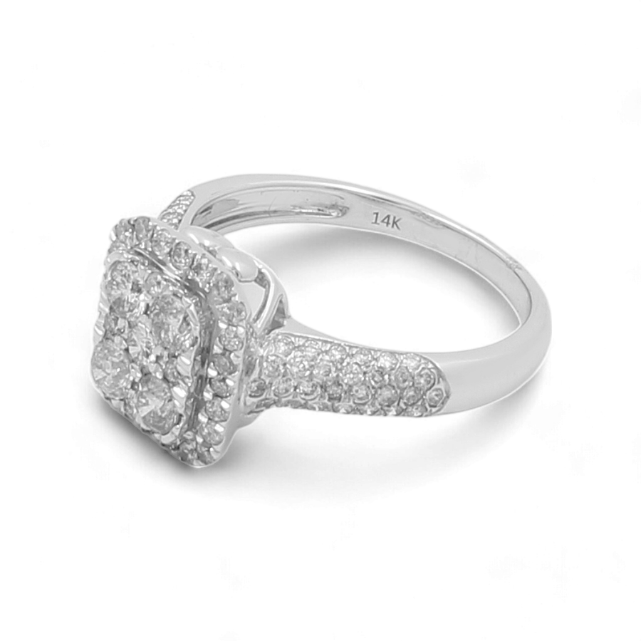 The Miral Jewelry White Gold 14K Woman Ring with Diamonds is a stunning engagement ring featuring a square halo setting adorned with multiple small diamonds and accented with cubic zirconias.