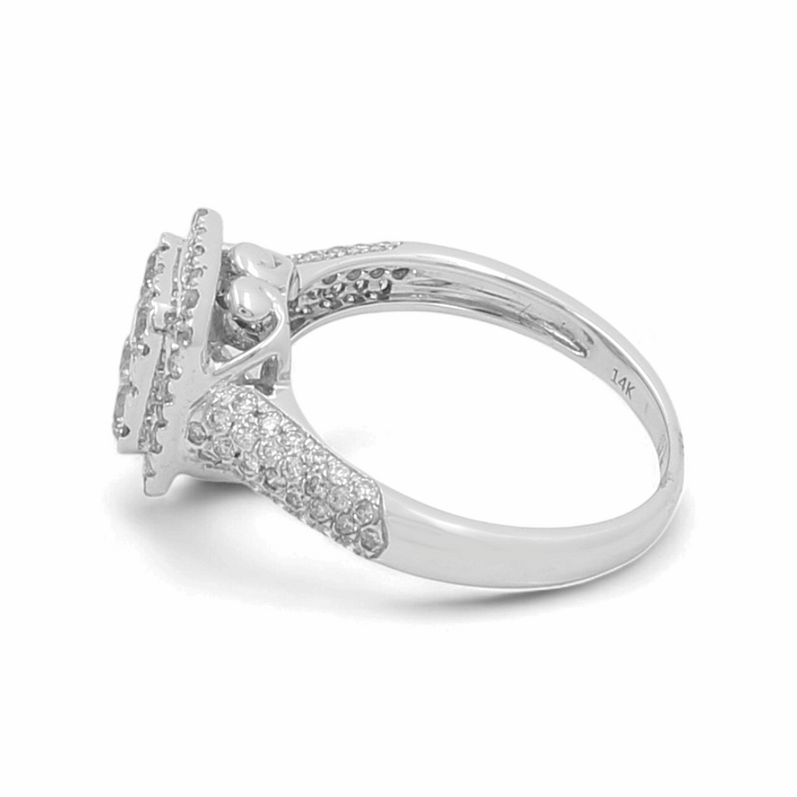 Introducing the exquisite 14K White Gold Bridal Woman Ring with Diamonds from Miral Jewelry, showcasing a dazzling 1 Ct central diamond surrounded by multiple small diamonds encrusted along the band's length.