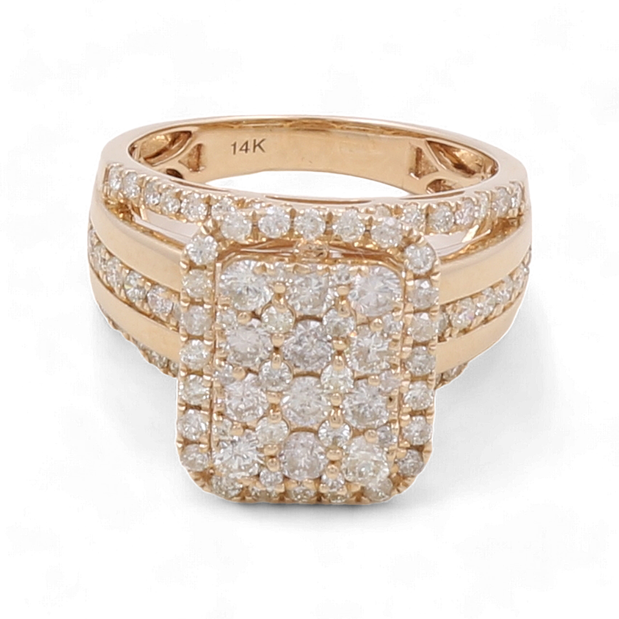 The 14K Yellow Gold Bridal Woman Ring with Diamonds by Miral Jewelry is a stunning piece featuring a rectangular cluster of multiple small diamonds, flanked by additional rows of diamonds along the band.