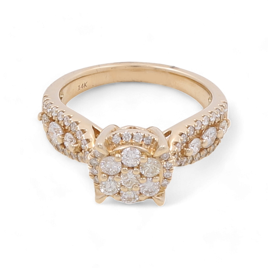 A stunning piece from Miral Jewelry’s bridal collection, the 14K Yellow Gold Bridal Woman Ring with Diamonds features intricate detailing and a central cluster of diamonds totaling 1 carat.