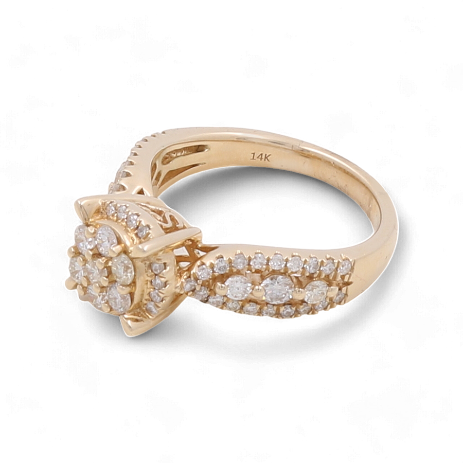 The Miral Jewelry 14K Yellow Gold Bridal Woman Ring with Diamonds features a central cluster of small diamonds and additional diamonds encrusted along the band. This stunning piece, labeled "14K" on the inside, boasts a total of 1 carat diamond weight in yellow 14 karat gold, making it an elegant addition to any bridal set.