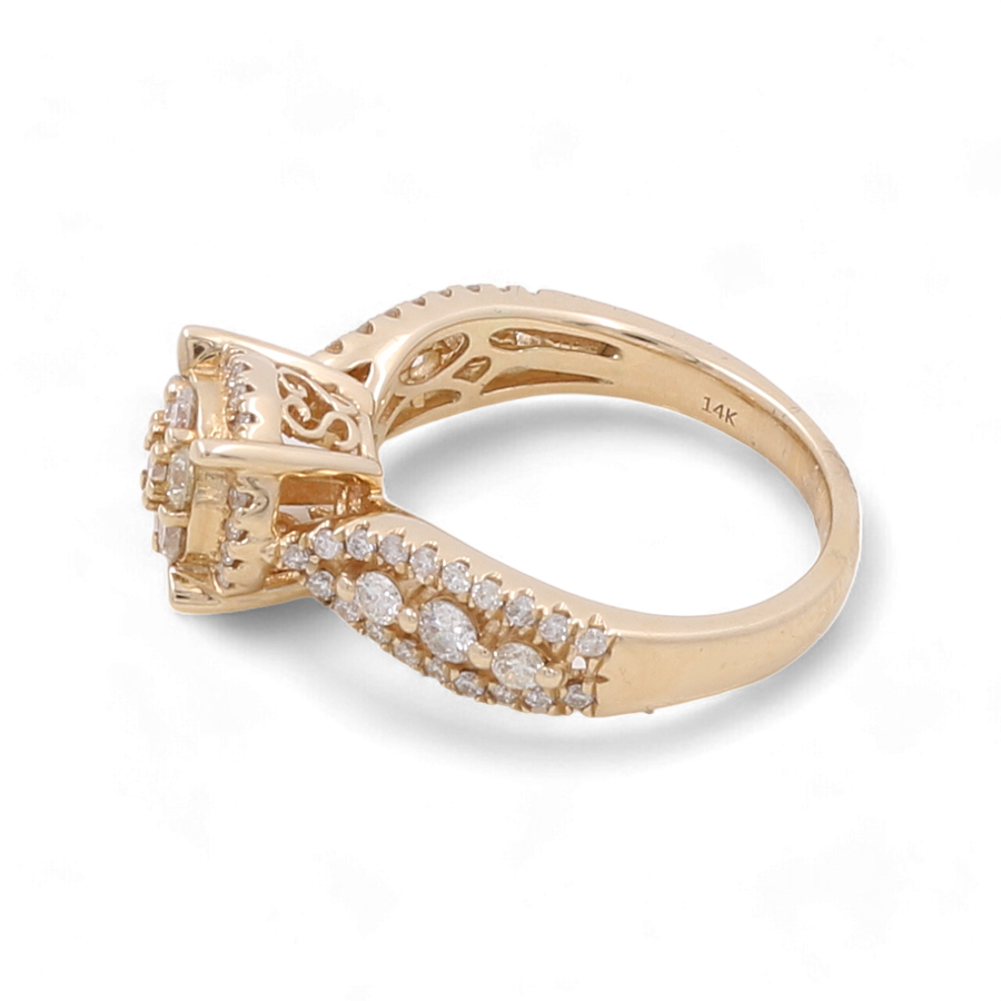 The 14K Yellow Gold Bridal Woman Ring with Diamonds by Miral Jewelry features a stunning gold ring adorned with a cluster of 1 carat diamonds on top, complemented by rows of smaller diamonds along the band. Inside the yellow 14 karat gold band is the marking "14K.