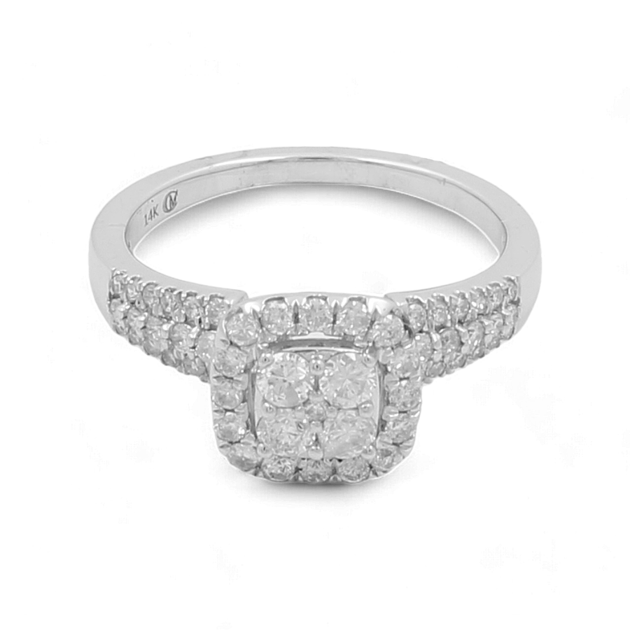 The 14K White Gold Bridal Woman Ring with Diamonds from Miral Jewelry showcases a stunning square cluster of diamonds set off by smaller diamonds adorning the band.