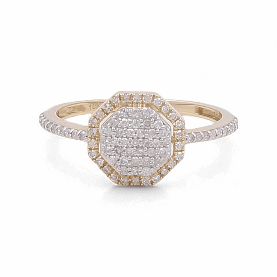 A 10K yellow gold bridal woman ring with a hexagonal diamond cluster setting from Miral Jewelry is displayed on a white background. Exuding luxury, the band's radiant design is also studded with small diamonds.