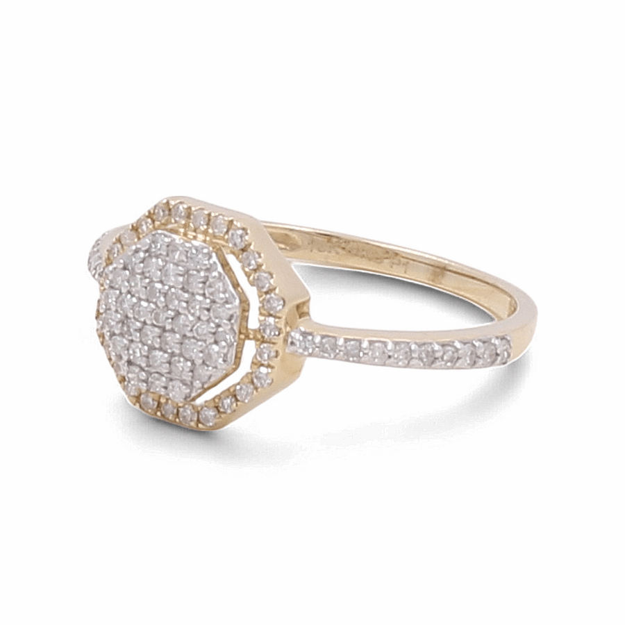 Miral Jewelry presents a stunning 10K yellow gold bridal ring for women, featuring an octagonal diamond-encrusted face and a diamond-studded band.