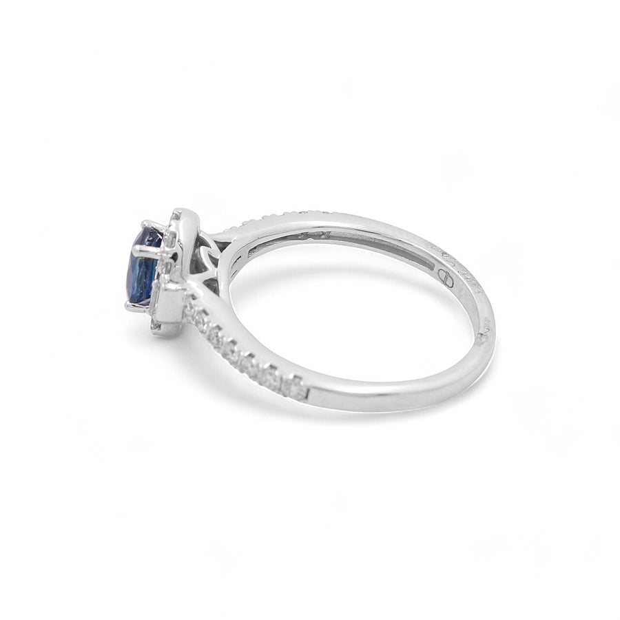 Introducing the 14K White Gold Woman Fashion Ring by Miral Jewelry, featuring a stunning rectangular-cut sapphire as its centerpiece, complemented by small round diamonds encrusted along the band.