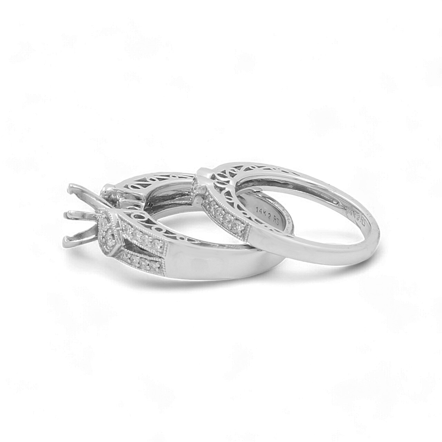 Two "14K White Gold Bridal Woman Rings with Diamonds" by Miral Jewelry, featuring intricate designs and embedded sparkling gemstones, are placed side by side on a white background.