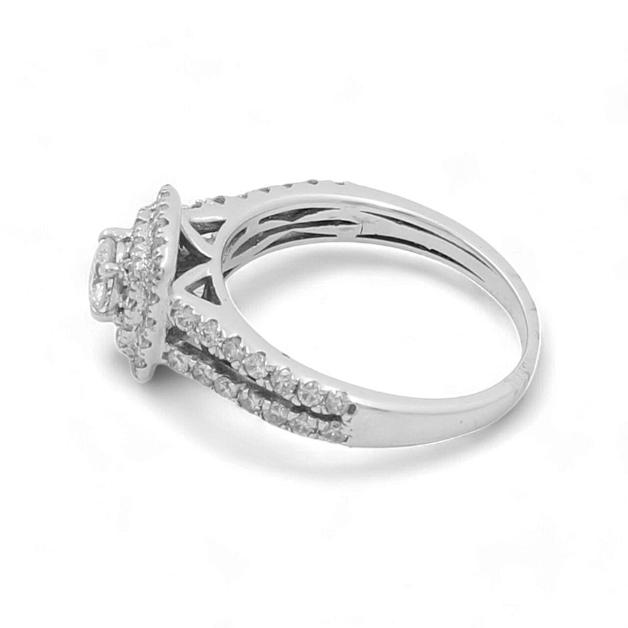 The 14K White Gold Bridal Woman Ring with Diamonds by Miral Jewelry features a stunning white gold band with a round central stone, flanked by two bands of shimmering diamonds on each side.