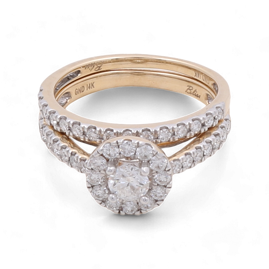 The Miral Jewelry 14K Yellow Gold Bridal Woman Ring features a stunning design with a diamond-studded band and a circular diamond centerpiece surrounded by smaller diamonds.