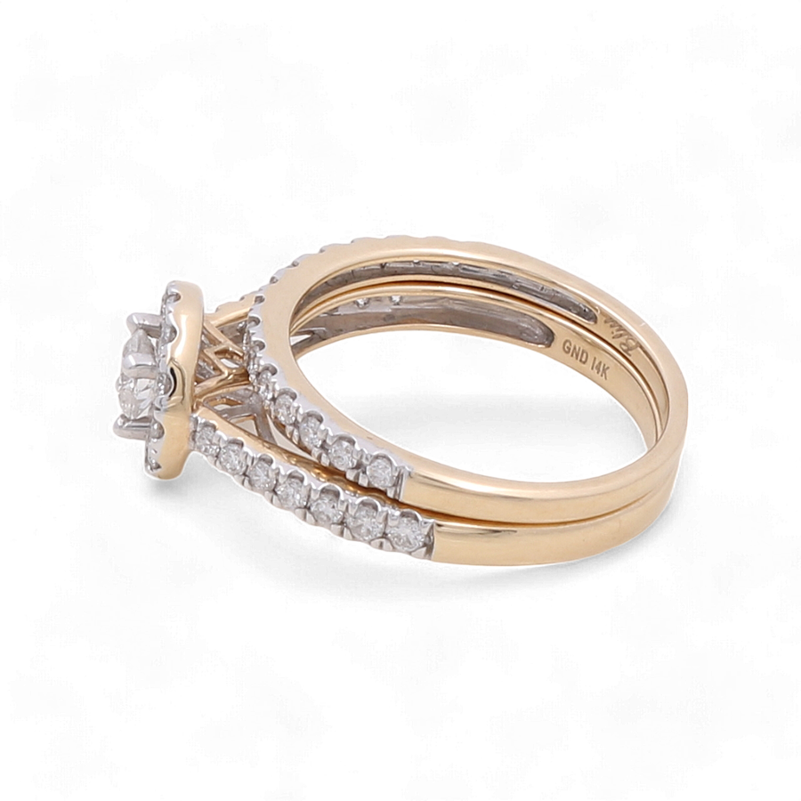 The Miral Jewelry 14K Yellow Gold Bridal Woman Ring with Diamonds showcases an exquisite oval-shaped diamond centerpiece, complemented by dazzling diamond accents on the band.