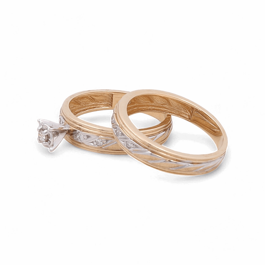 Two stunning rings from Miral Jewelry, crafted from 14K yellow gold: one is a beautiful "14K Yellow Gold Bridal Woman Ring with Diamonds" featuring a single diamond solitaire setting, and the other boasts intricate decorative engravings, both set against a white backdrop.