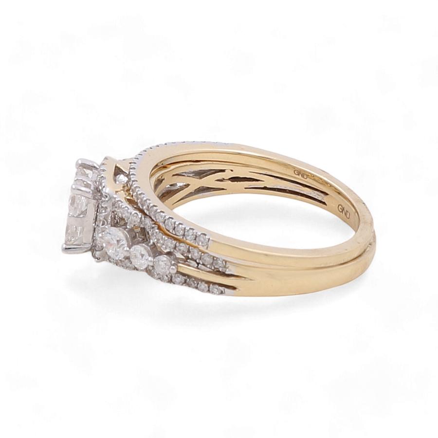 Miral Jewelry's 14K Yellow Gold Bridal Woman Ring with Diamonds is a breathtaking piece, featuring a central rectangular stone flanked by dazzling diamonds and additional smaller round stones adorning the bands, perfect for any woman seeking timeless elegance.