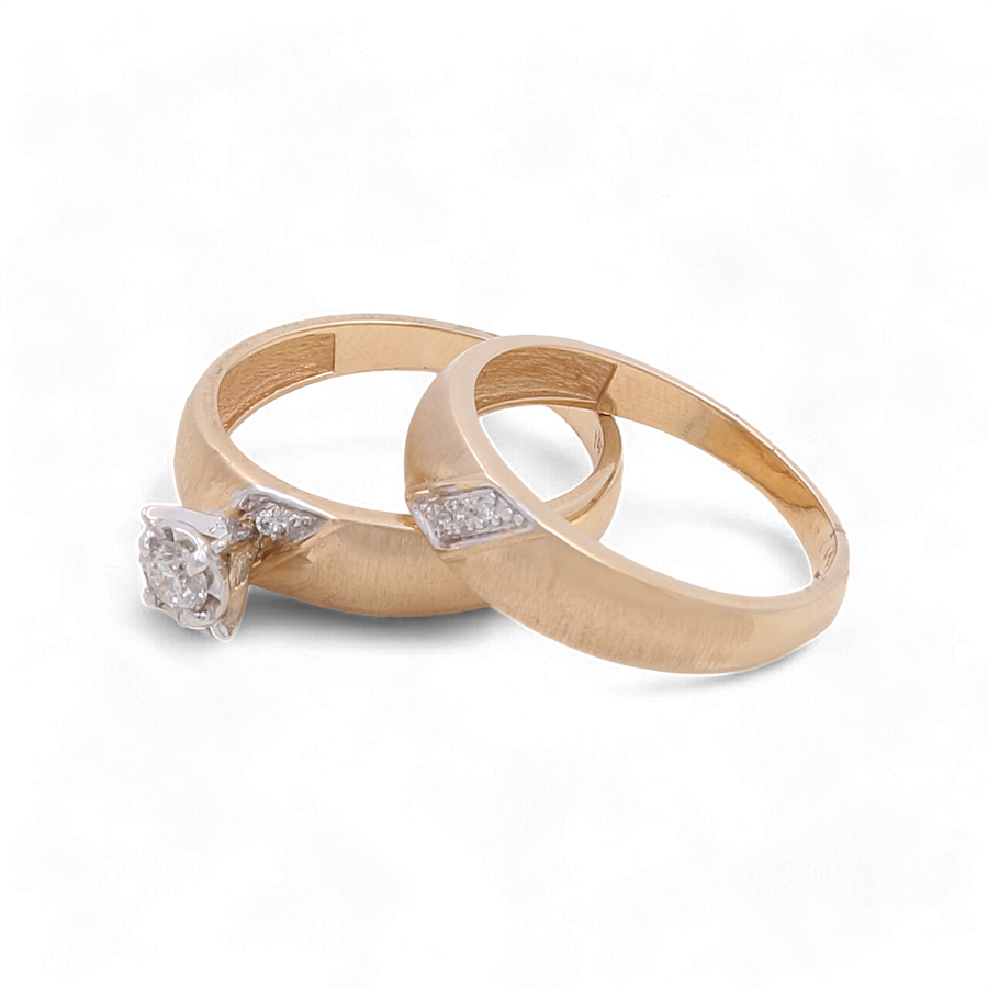 Two 14K Yellow Gold Bridal Woman Rings from Miral Jewelry are displayed on a white background. One ring, named "14K Yellow Gold Bridal Woman Ring with Diamonds," features a diamond solitaire, while the other has small diamonds embedded in its band.