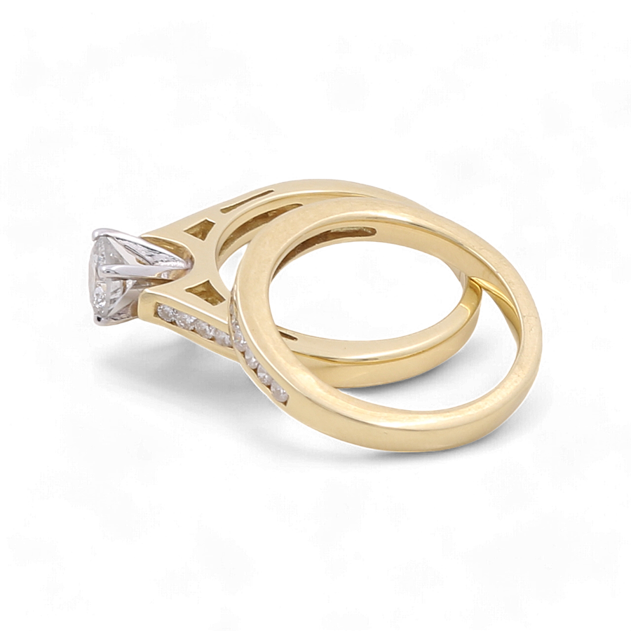 Introducing the Miral Jewelry 10K Yellow Gold Bridal Woman Ring with Diamonds, featuring a stunning engagement ring with a dazzling diamond centerpiece paired with a matching gold wedding band adorned with delicate embedded diamonds.