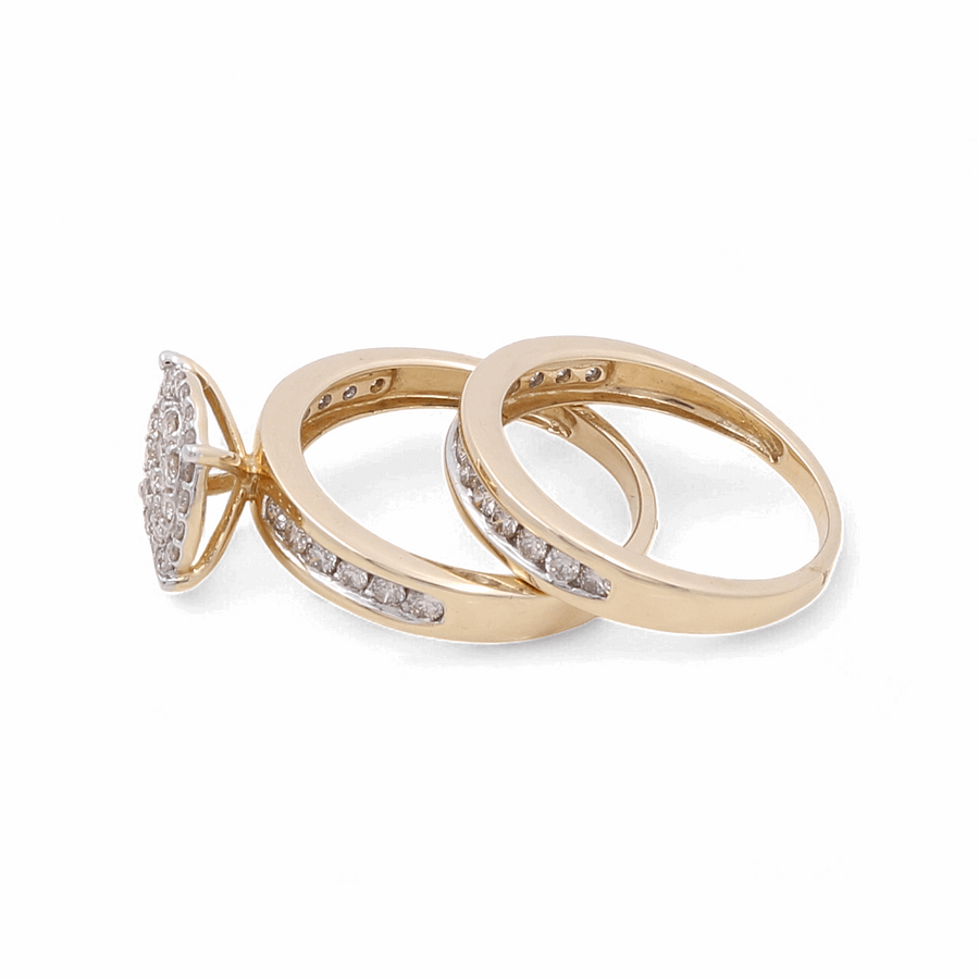 A set of two Miral Jewelry 10K Yellow Gold rings, each adorned with a row of small diamonds, includes a bridal woman's ring featuring a circular diamond cluster on the top.