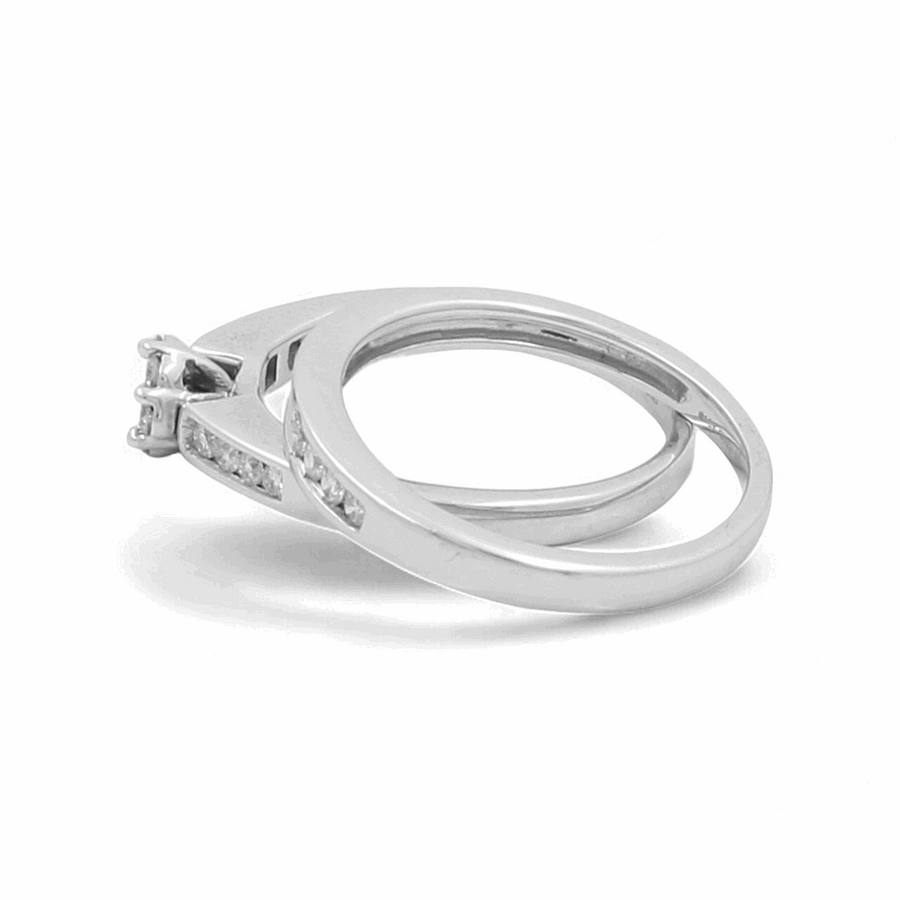 Two connected 10K white gold rings from Miral Jewelry are displayed against a white background. One ring features a raised central stone set in a prong setting, while the other showcases delicate diamonds. The product is named the 10K White Gold Bridal Woman Ring with Diamonds.