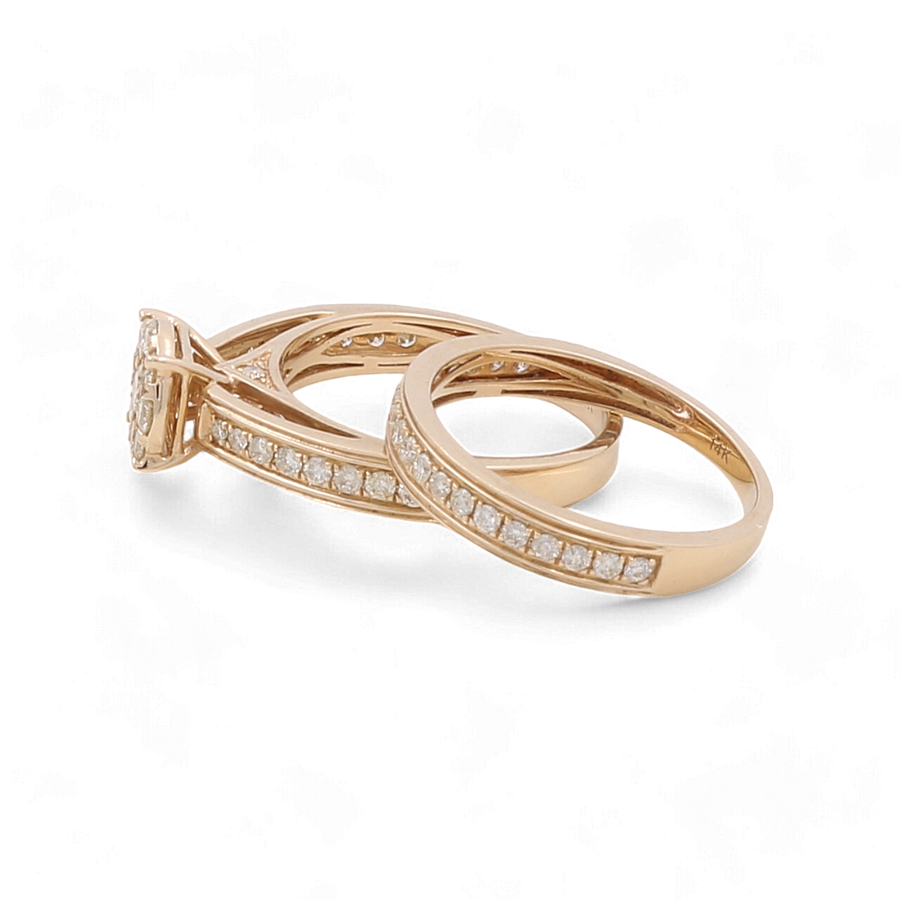 Three bridal woman rings with embedded diamonds, including one with a larger diamond centerpiece, crafted in 14K yellow gold by Miral Jewelry and displayed on a white background.