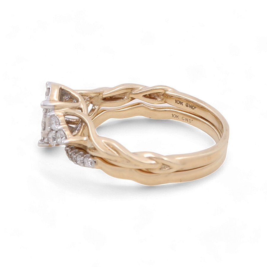 A 10K yellow gold bridal woman ring with a diamond centerpiece and an intertwined band design by Miral Jewelry is shown against a white background.