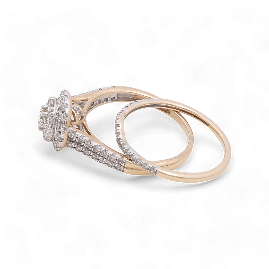 A set of gold rings from Miral Jewelry, including a 14K Yellow Gold Bridal Woman Ring with Diamonds featuring an intricate design and a simple 10K yellow gold band.