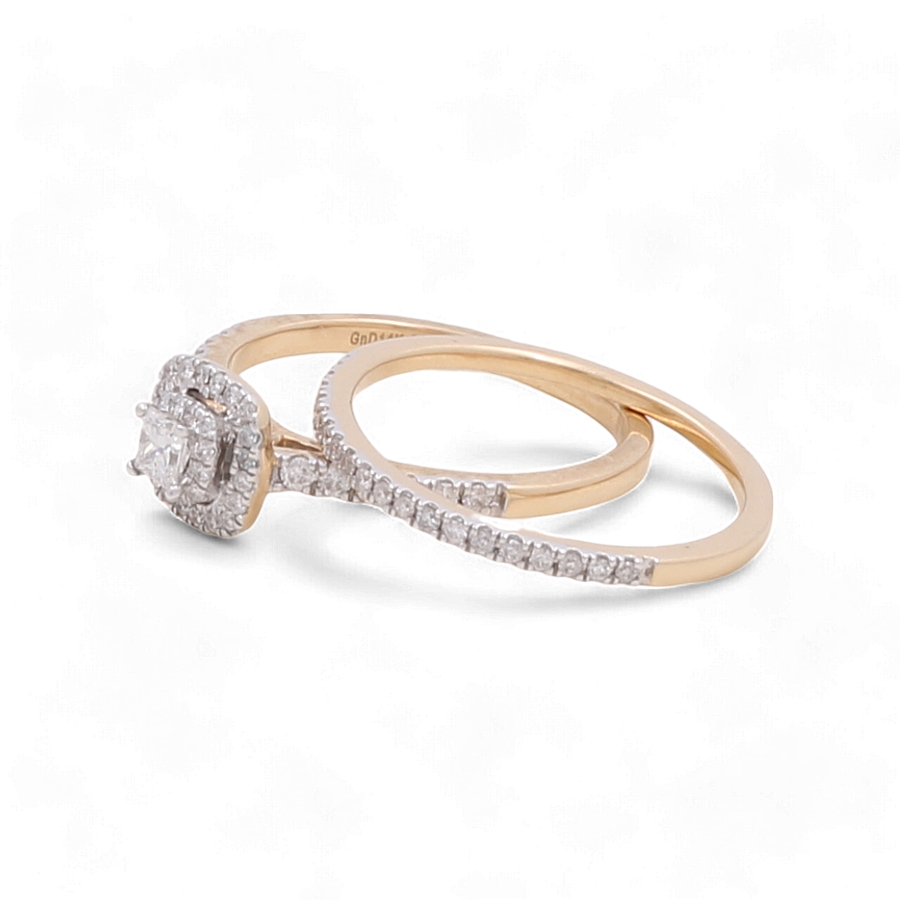 The Miral Jewelry 14K Yellow Gold Bridal Woman Ring with Diamonds features a stunning engagement ring set with diamond details, highlighting a larger central diamond surrounded by smaller diamonds, and is accompanied by a matching gold wedding band embedded with exquisite diamonds.