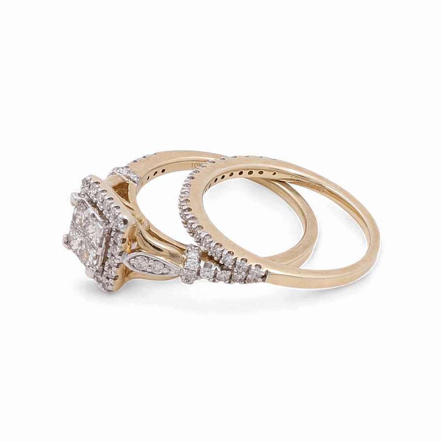 A 10K yellow gold bridal woman's ring by Miral Jewelry, featuring a large square diamond center stone, elegantly accented with smaller diamonds on the band and halo.