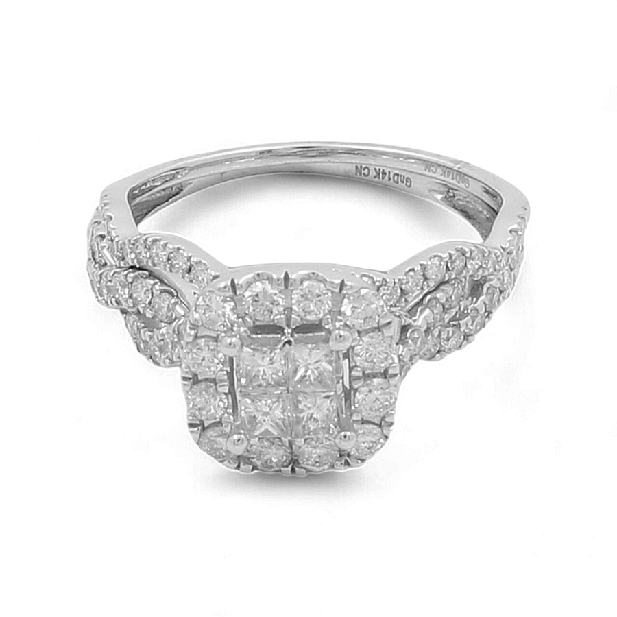 The 14K white gold bridal woman’s ring by Miral Jewelry features a square cluster of small diamonds set in a symmetrical arrangement on the band, with additional diamonds on the shoulders—a timeless symbol of love and commitment.