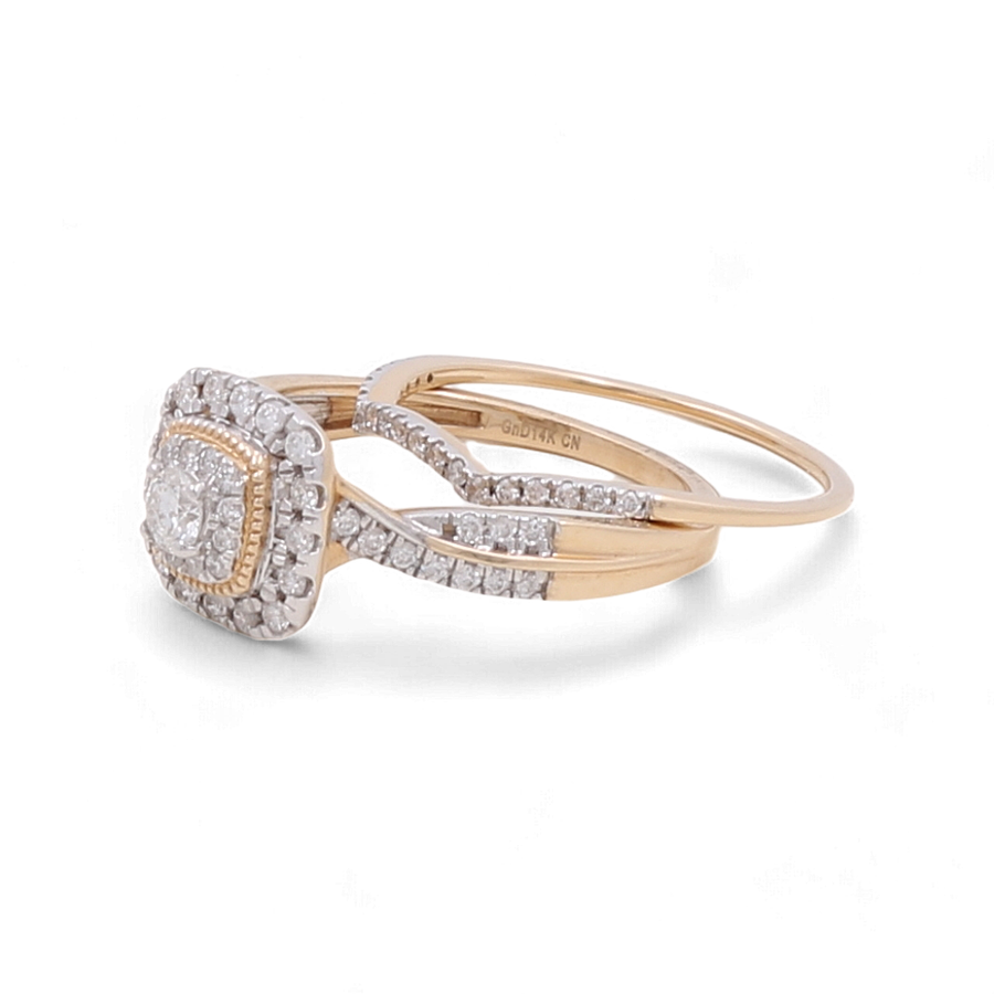 The 14K Yellow Gold Bridal Woman Ring by Miral Jewelry showcases a rectangular, diamond-encrusted setting paired with a matching twisted band.