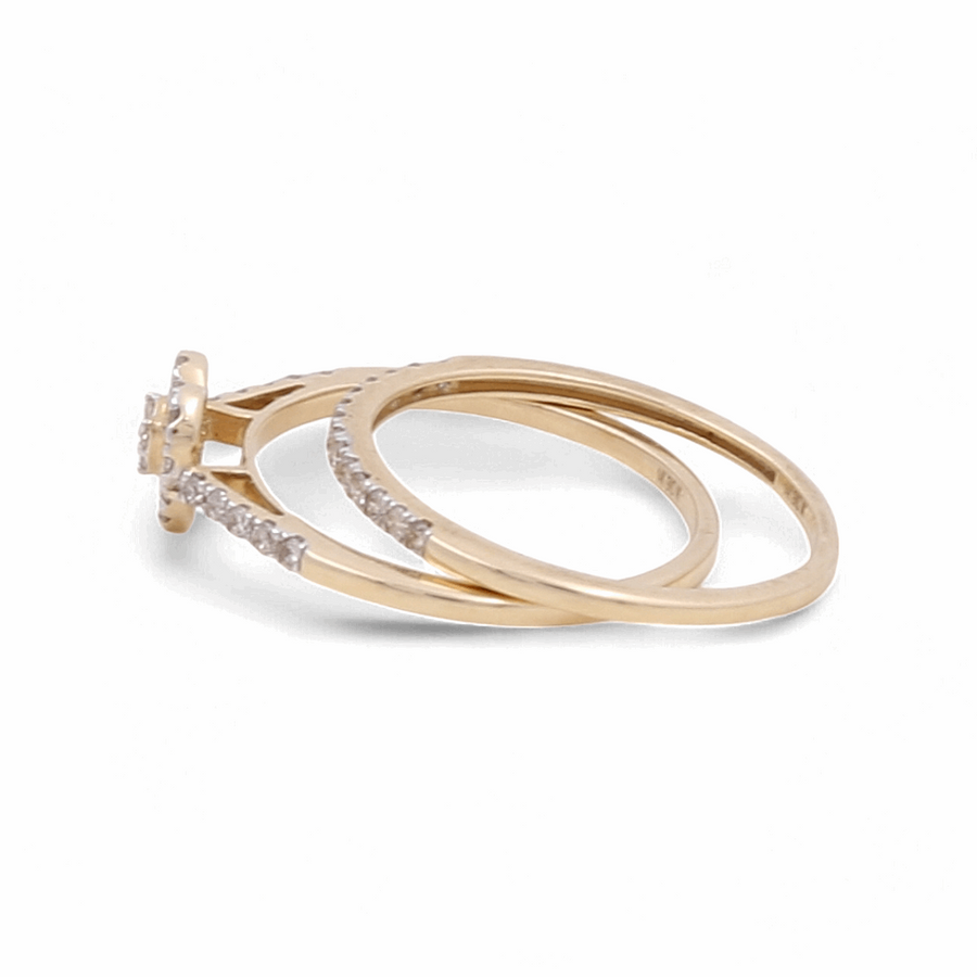 A 14K Yellow Gold Bridal Ring set by Miral Jewelry featuring a delicate design embellished with diamonds, perfect for the modern woman.